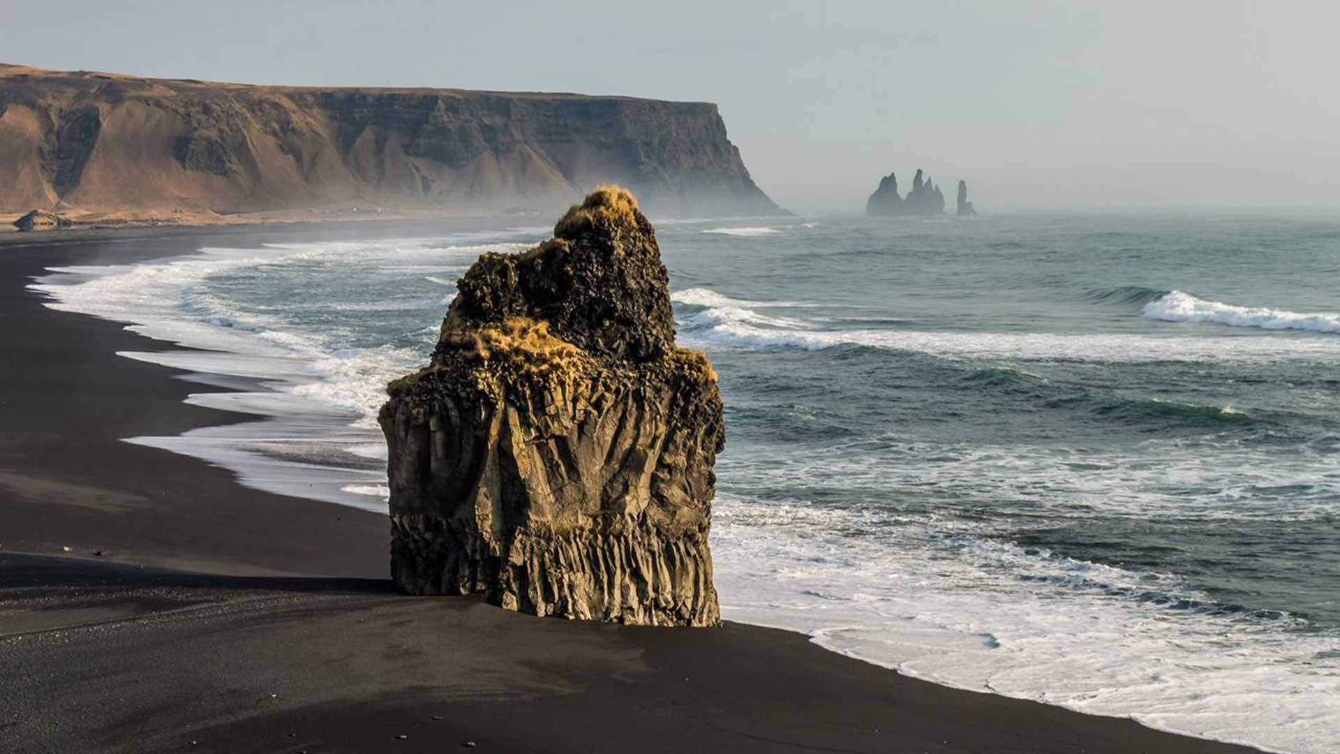 Iceland-black-beach Women's Iceland northern lights