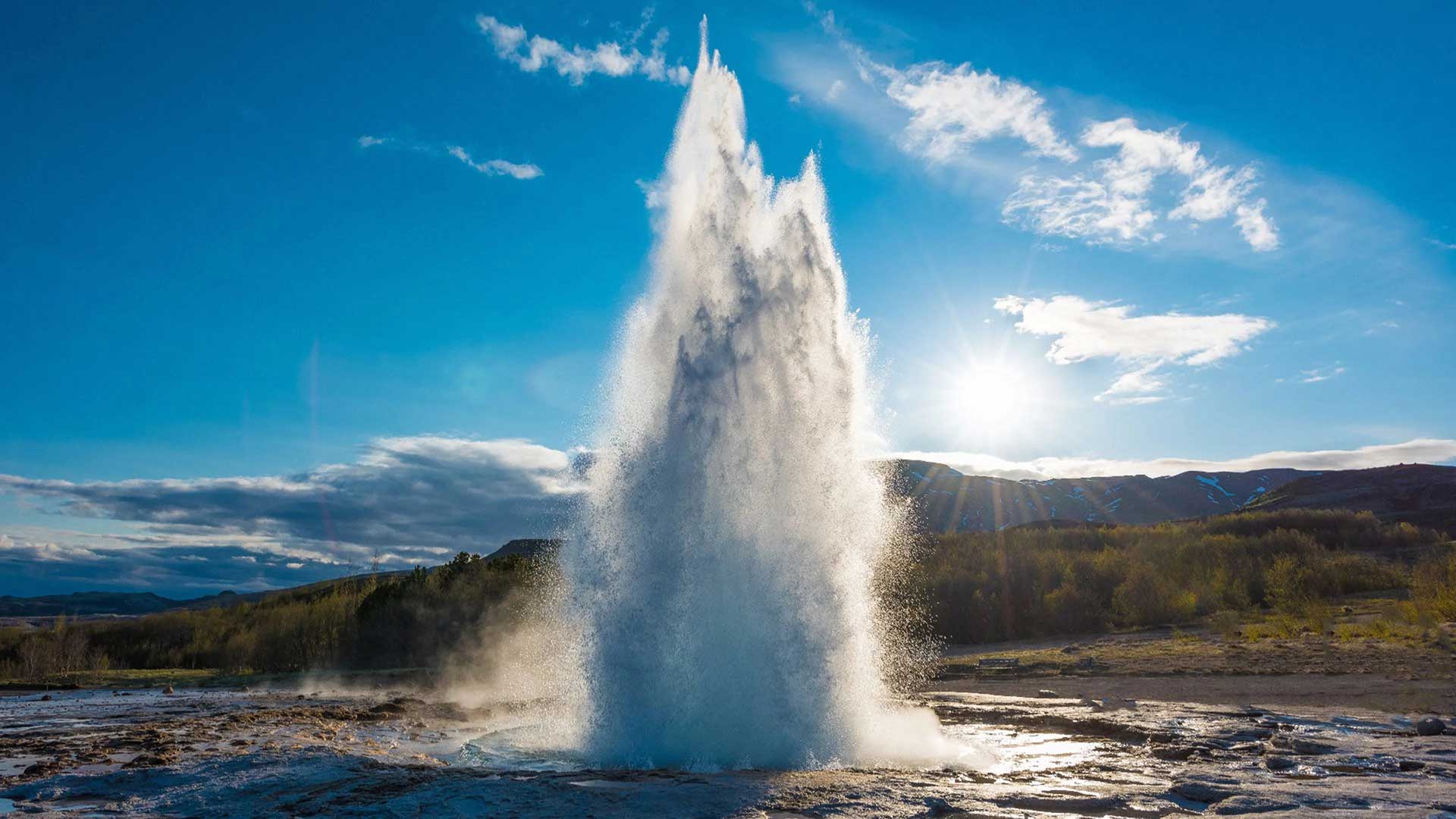 strokkur-geyser-erupting-Iceland-womens-adventure