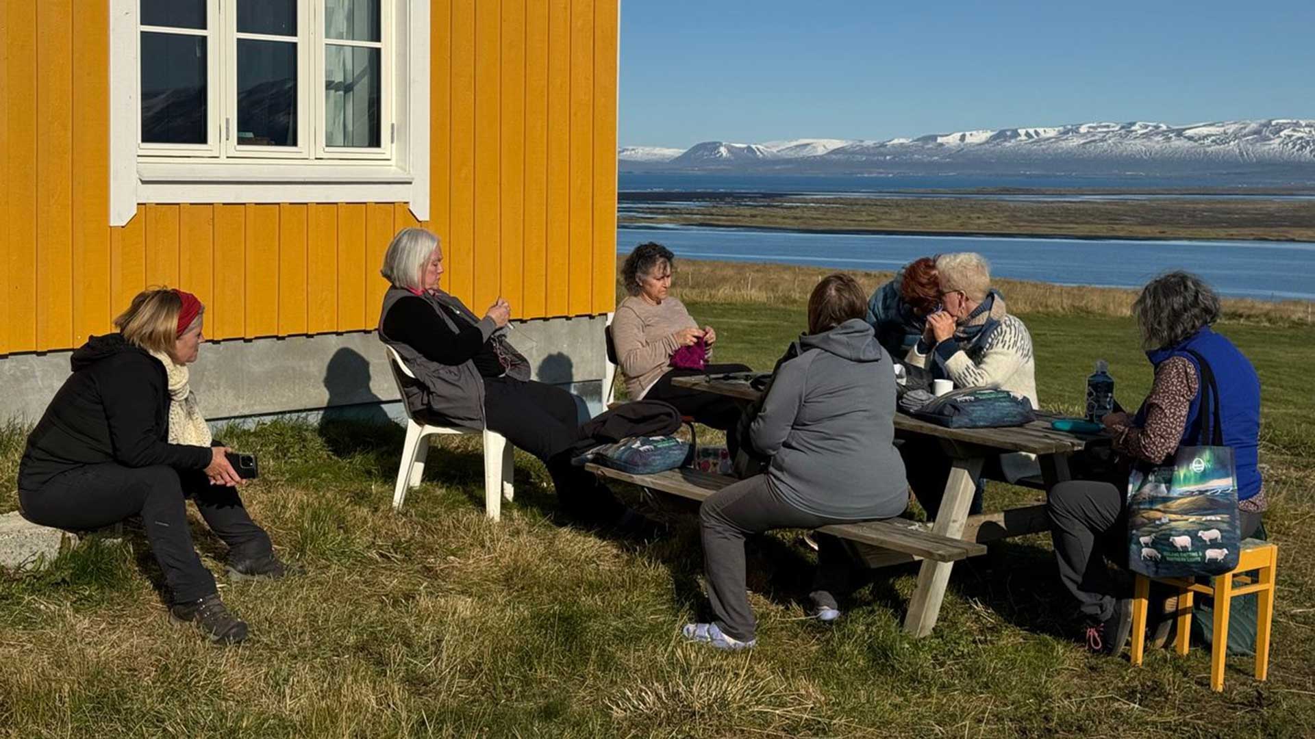 Iceland-womens-knitting-northern-lights-tour-outdoors-picnic-table